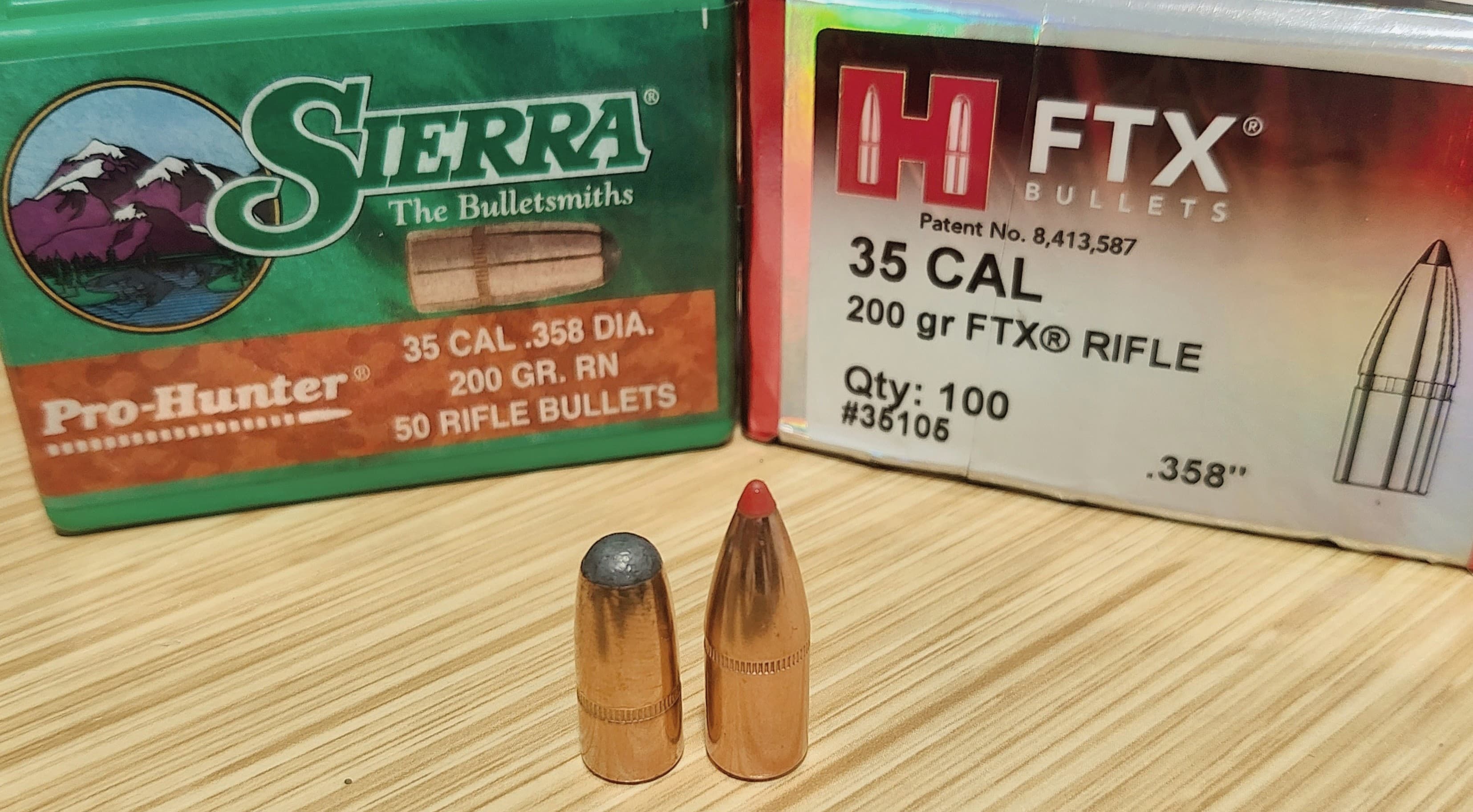 A 200-grain Sierra Pro-Hunter bullet beside a 200-grain Hornady FTX bullet